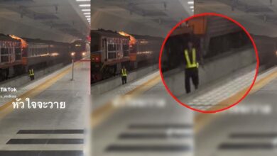 พนักงานวิ่งบนรางรถไฟ