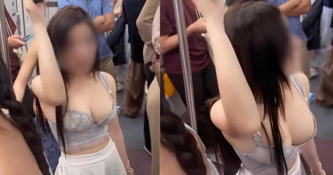 A girl with a great figure and big breasts shows off her balancing act on the electric train. causing the viewer to focus on the wrong point