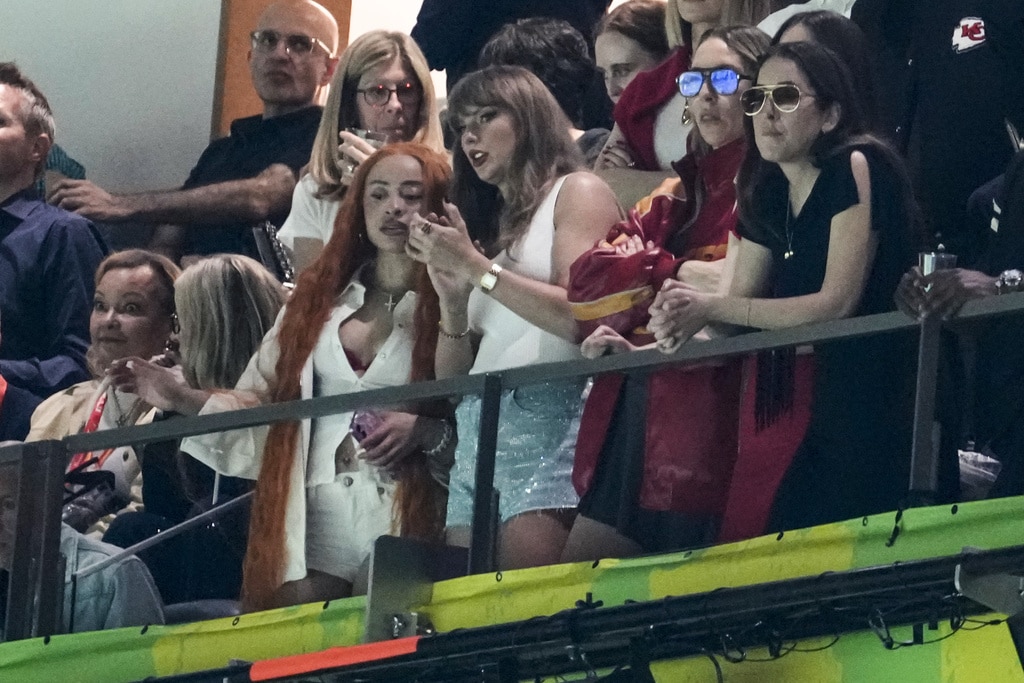 Ice Spice, from left, Taylor Swift, Este Haim and Alana Haim watch during the first half of the NFL Super Bowl 59 football game between the Kansas City Chiefs and the Philadelphia Eagles, Sunday, Feb. 9, 2025, in New Orleans. 