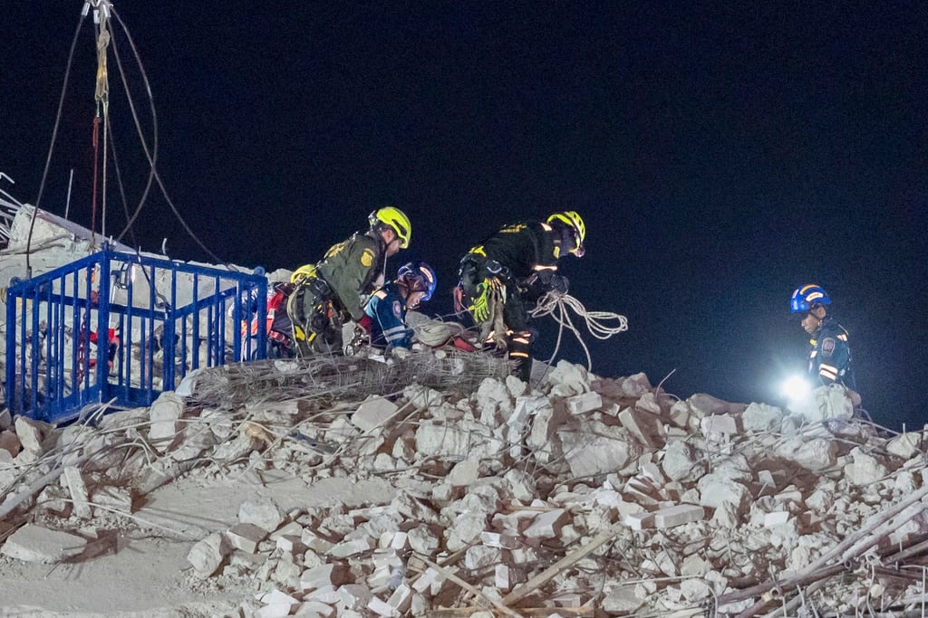 Rescuers work at the site of an under-construction high-rise building that collapsed after an earthquake in Bangkok, Thailand, Monday, March, 31, 2025.