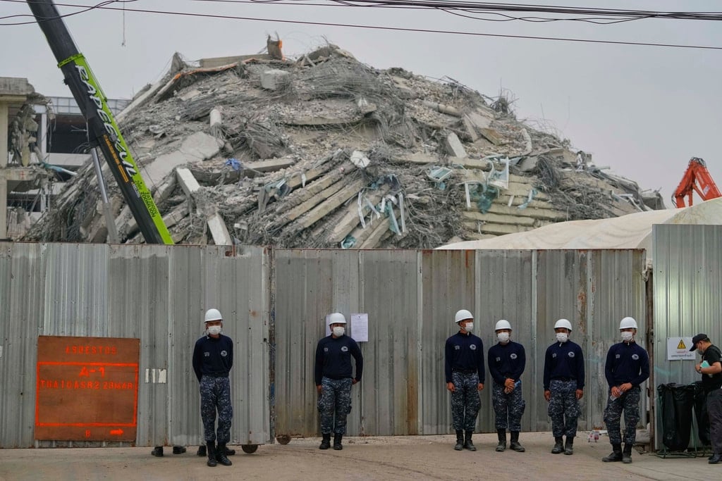 Thai army soldiers stand guard outside the site of an under-construction high-rise building that collapsed after an earthquake in Bangkok, Thailand, Monday, March 31, 2025.
