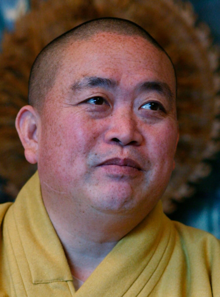FILE - In this July 3, 2006 photo, Shi Yongxin, abbot of Shaolin Temple speaks at the Shaolin Temple in Dengfeng in central China's Henan province.