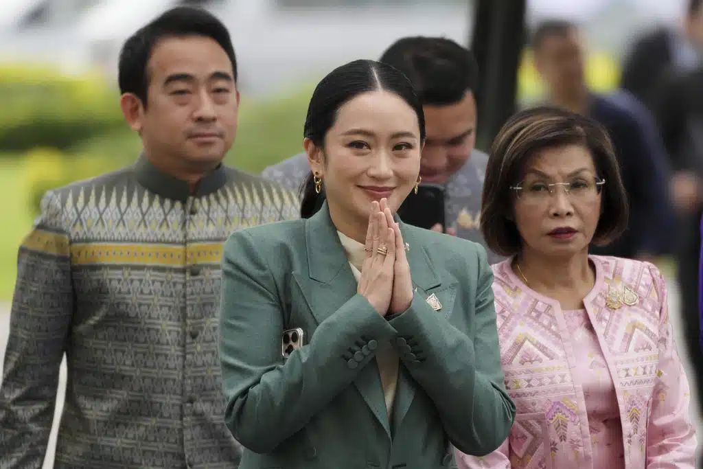 Thailand's Prime Minister Paetongtarn Shinawatra, center, arrives at Government House for a cabinet meeting in Bangkok, Thailand, Tuesday, July 1, 2025.