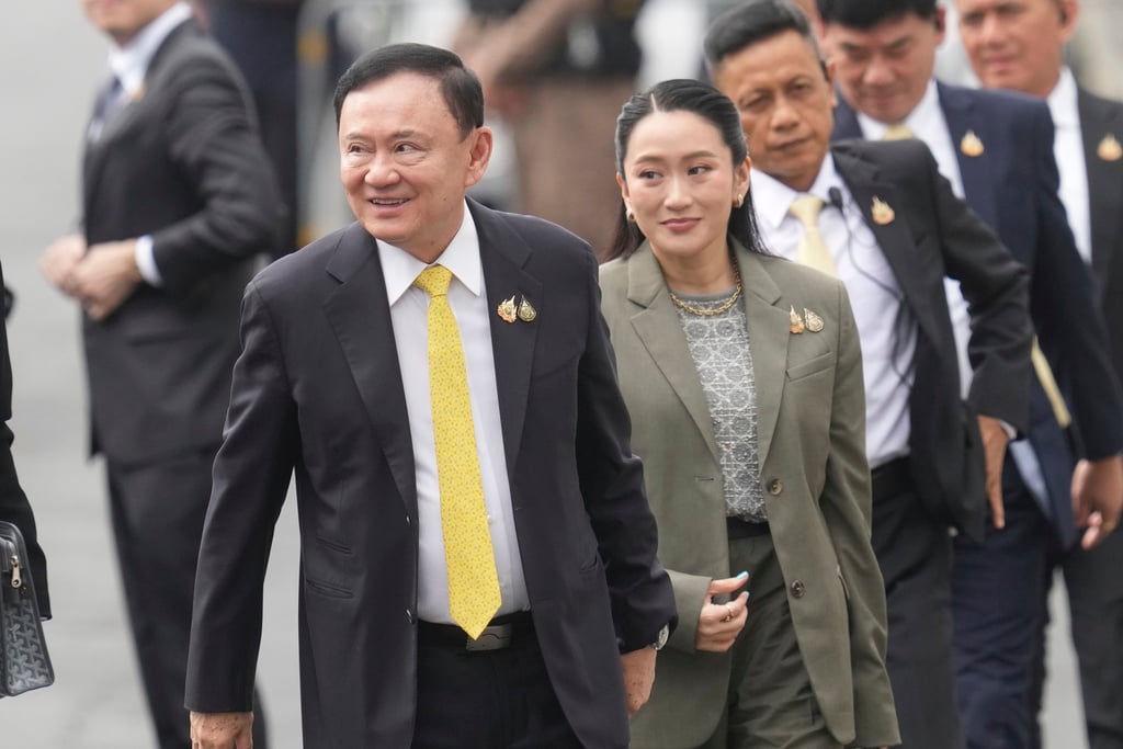 CORRECTS NAME OF DAUGHTER - Thailand's former Prime Minister Thaksin Shinawatra, left, and his daughter and former Prime Minister Paetongtarn Shinawatra, right, arrive at Supreme Court in Bangkok, Thailand, Tuesday, Sept. 9, 2025.