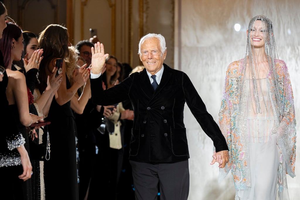 FILE - Giorgio Armani waves at the end of the Giorgio Armani Prive Haute Couture Spring Summer 2025 collection in Paris, Jan. 28, 2025. 
