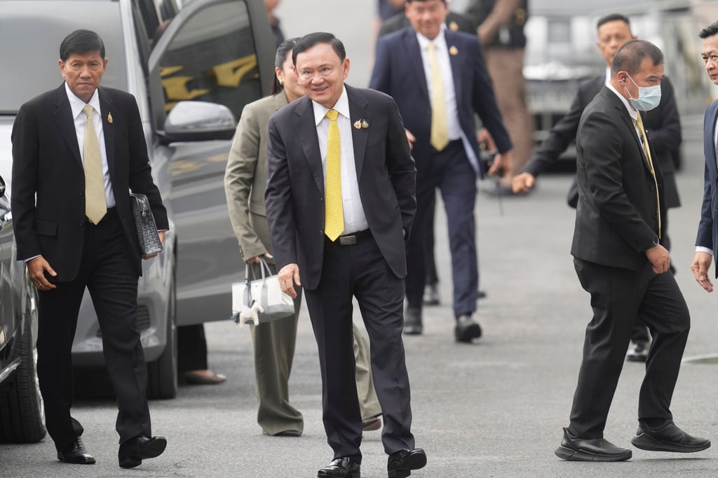 Thailand's former Prime Minister Thaksin Shinawatra, center, arrives at Supreme Court in Bangkok, Thailand, Tuesday, Sept. 9, 2025.