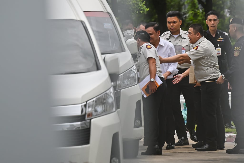 Thailand's former Prime Minister Thaksin Shinawatra, second from left, leaves the Supreme Court for Bangkok Remand Prison in Bangkok, Thailand, Tuesday, Sept. 9, 2025.