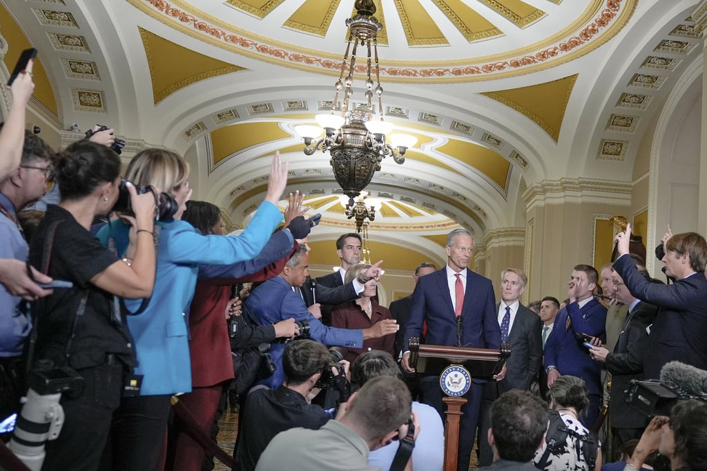 Senate Majority Leader John Thune, R-S.D., center, speaks during a news conference after a policy luncheon at the Capitol, Tuesday, Sept. 30, 2025, in Washington.