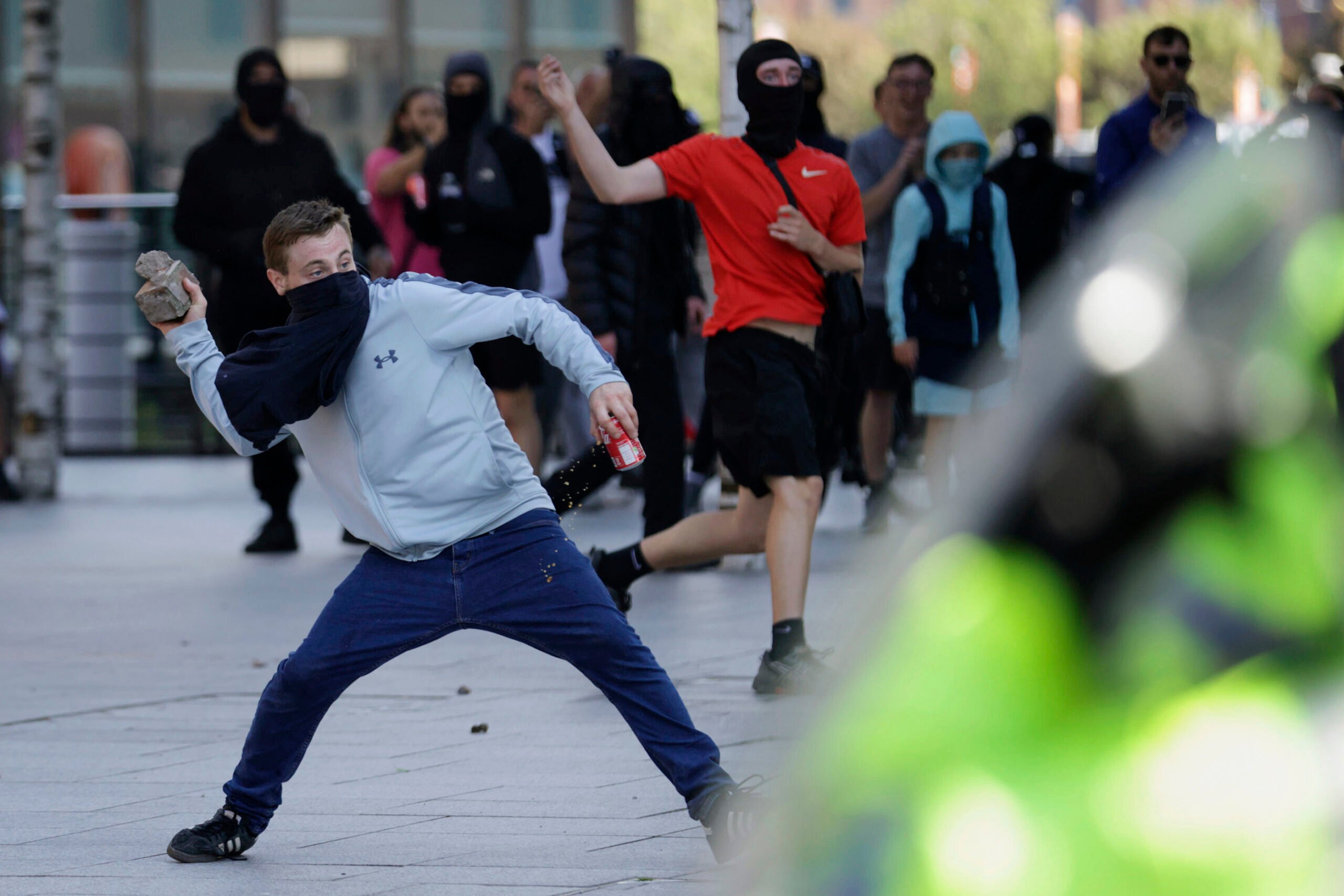 Police charge at protesters in Liverpool, England, Saturday Aug. 3, 2024, following the stabbing attacks on Monday in Southport, in which three young children were killed.