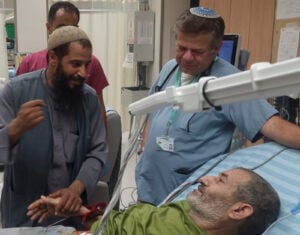 In this photo released by Soroka Medical Center on Tuesday, Aug. 27, 2024, Qaid Farhan Alkadi, 52, who was held hostage by Hamas militants in Gaza lies on a bed of the ‏Soroka Medical Center in Beersheba, Israel. (Soroka Medical Center via AP).