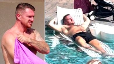 The 41-year-old Robinson was pictured kicking back after fleeing the UK for Cyprus Robinson