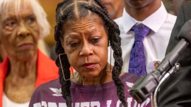 Tears stream down the face of Donna Massey as she listens to Attorney Ben Crump speak during a press conference over the shooting death of her daughter Sonya