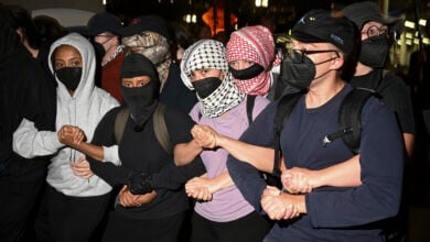 Protesters leave a demonstrate near the Israeli Consulate during the Democratic National Convention Tuesday, Aug. 20, 2024, in Chicago. (AP Photo/Noah Berger).