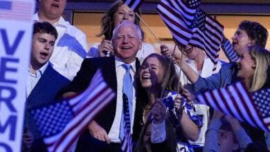 Democratic vice presidential candidate Minnesota Gov. Tim Walz and his daughter Hope Walz arrive at the Democratic National Convention Thursday, Aug. 22, 2024, in Chicago. (AP Photo/Brynn Anderson).