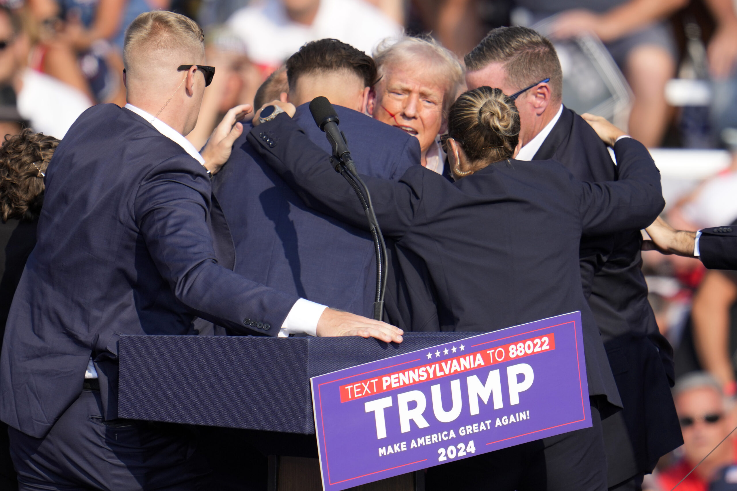 Republican presidential candidate former President Donald Trump is surrounded by Secret Service at a campaign event in Butler, Pa., July 13, 2024. A senior FBI official says the gunman in the assassination attempt of former President Donald Trump searched online for events of both Trump and President Joe Biden and saw the Pennsylvania campaign rally where he opened fire last month as a “target of opportunity." (AP Photo/Gene J. Puskar, File).