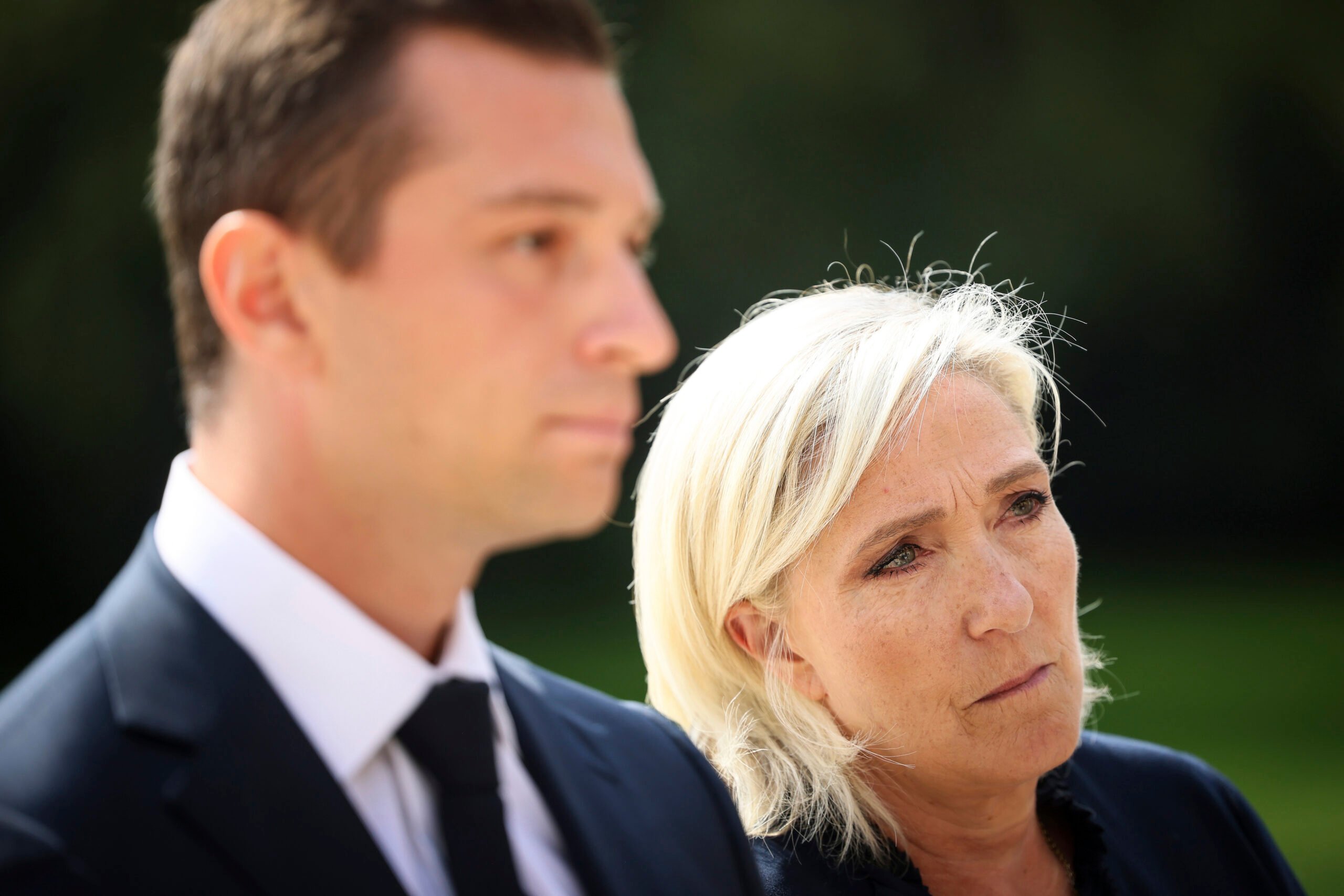 French far-right leader Marine Le Pen and National Rally president Jordan Bardella answer journalists after a meeting with French President Emmanuel Macron who is holding talks with key political players in a bid to form a new government, Monday, Aug. 26, 2024 at the Elysee Palace in Paris. (AP Photo/Thomas Padilla).