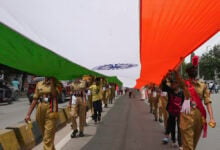 People participate in a rally holding a giant Indian flag during Independence Day celebrations in Hyderabad, India, Thursday, Aug. 15, 2024. (Mahesh Kumar A.)