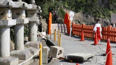 Stone lanterns fall at a shrine following a strong earthquake in Nichinan, Miyazaki prefecture, southern Japan, on Aug. 9, 2024. (Kyodo News via AP).