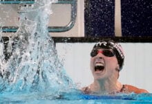 Katie Ledecky, of the United States, celebrates after winning the women's 1500-meter freestyle final at the 2024 Summer Olympics, Wednesday, July 31, 2024, in Nanterre, France.