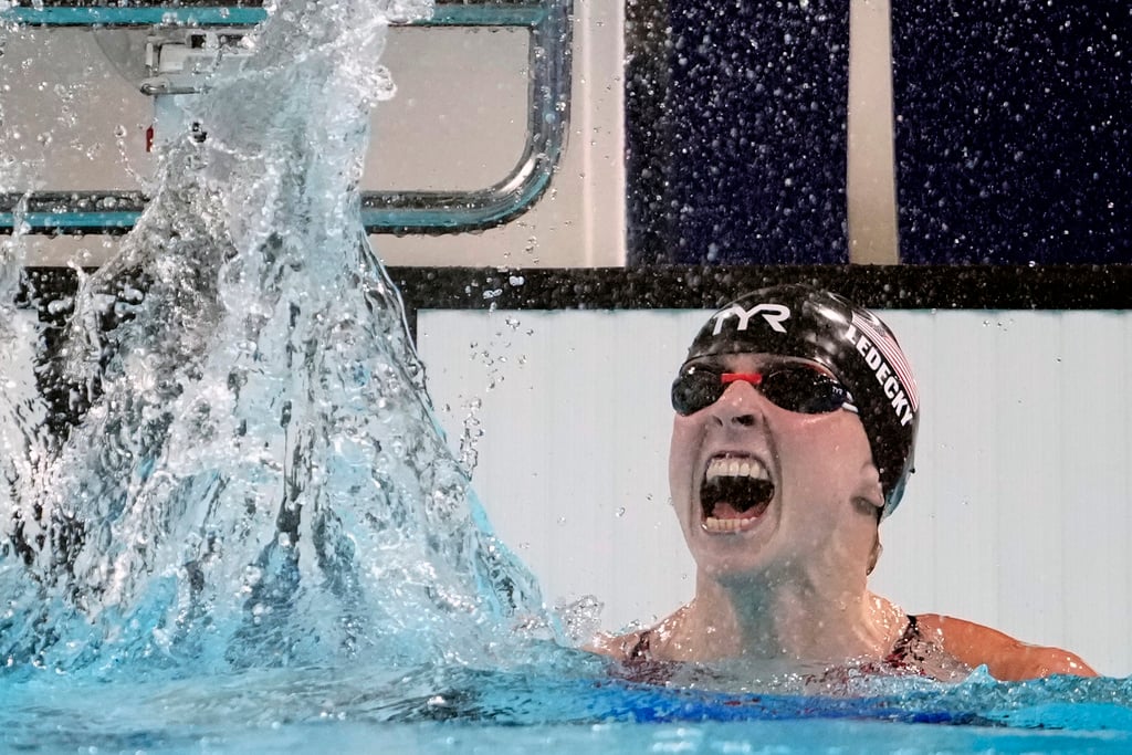 Katie Ledecky, of the United States, celebrates after winning the women's 1500-meter freestyle final at the 2024 Summer Olympics, Wednesday, July 31, 2024, in Nanterre, France.