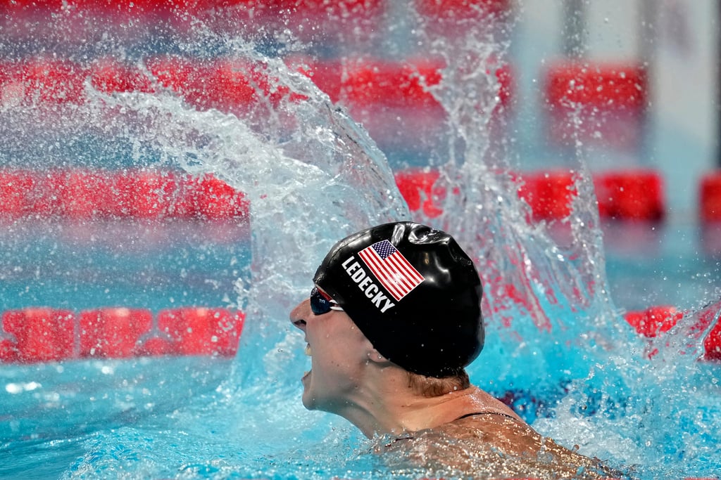 Katie Ledecky, of the United States, celebrates after winning the women's 1500-meter freestyle final at the 2024 Summer Olympics, Wednesday, July 31, 2024, in Nanterre, France. 