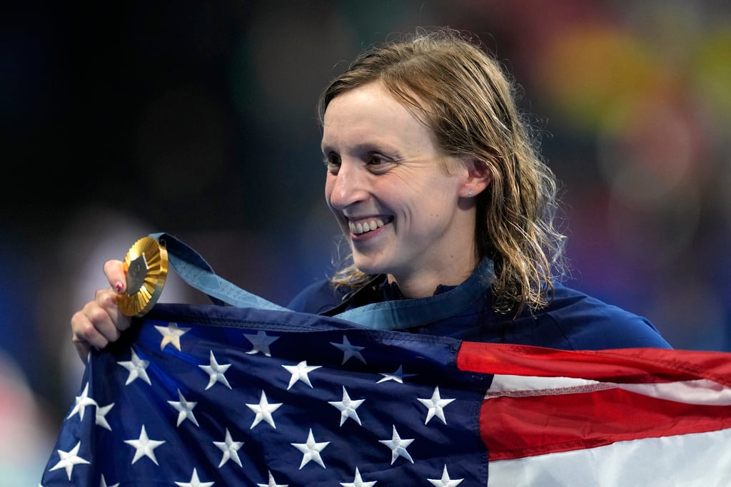 Gold medalist Katie Ledecky, of the United States, poses after the women's 1500-meter freestyle final at the 2024 Summer Olympics, Wednesday, July 31, 2024, in Nanterre, France. 