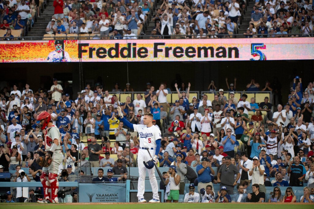 Los Angeles Dodgers' Freddie Freeman waves to the stands during the first inning of a baseball game against the Philadelphia Phillies in Los Angeles, Monday, Aug. 5, 2024. Freeman has missed last eight games as his youngest son Maximus was diagnosed with Guillan-Barre syndrome. 