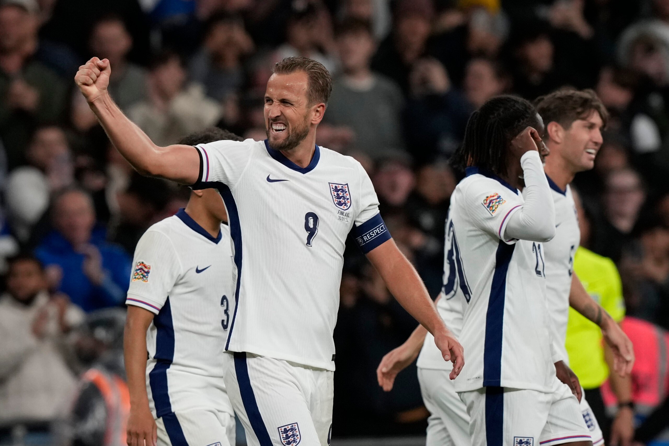 England's Harry Kane, left, celebrates after scoring his side's second goal during the Group F UEFA Nations League soccer match between England and Finland at Wembley Stadium in London, Tuesday, Sept. 10, 2024. (AP Photo/Frank Augstein).