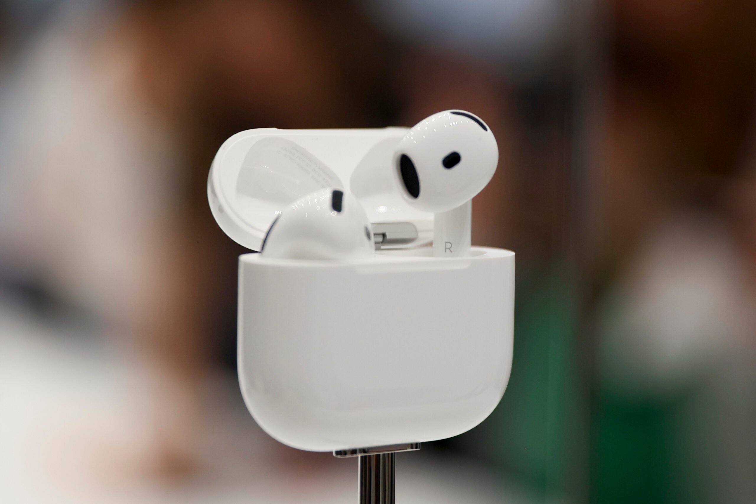 AirPods are displayed during an announcement of new products at Apple headquarters Monday, Sept. 9, 2024, in Cupertino, Calif. (AP Photo/Juliana Yamada).