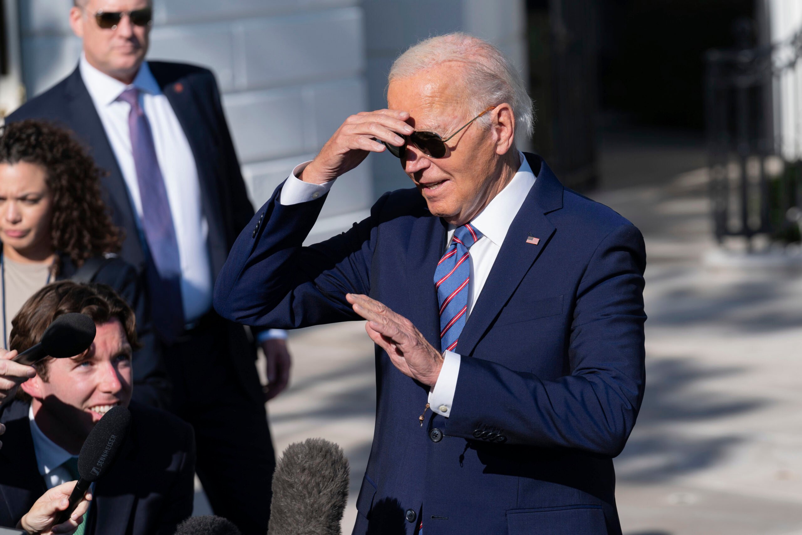 President Joe Biden talks to reporters on the South Lawn of the White House in Washington, Tuesday, Sept. 10, 2024, before departing to New York City. (AP Photo/Jose Luis Magana).