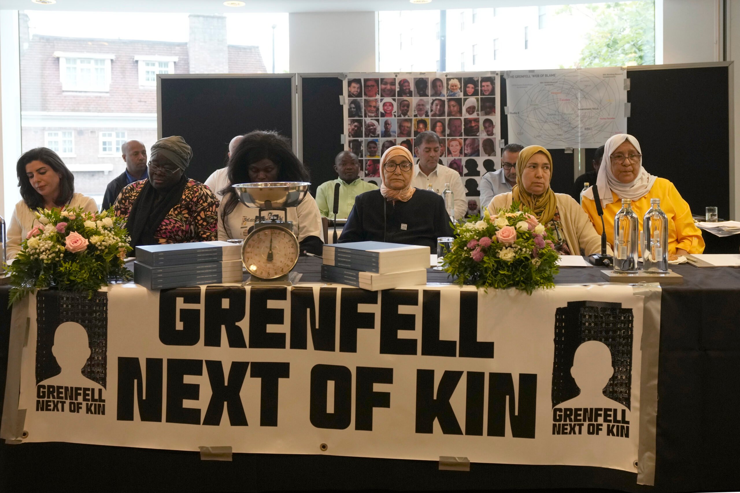 Relatives of the deceased and people directly affected by the Grenfell Tower fire react to the final report into the fire being released in London, Wednesday, Sept. 4, 2024. The report on the fire in which 72 people were killed in June 2017, says decades of failure by government and industry made the high-rise a "death trap". (AP Photo/Frank Augstein).