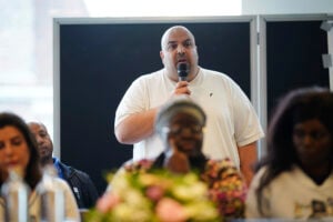 Hisam Choucair, who lost six family members, his mother, sister, brother-in-law and three nieces, speaks during a press conference consisting of the immediate families of 34 of the 72 people killed in the Grenfell Tower Fire in 2017, in London, Wednesday, Sept. 4, 2024, following the publication of the final report published by the long-running Grenfell Tower Inquiry. (Yui Mok/PA via AP).