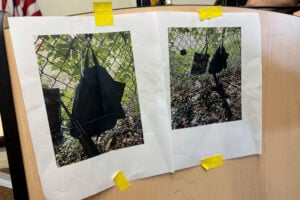 Photos that show an AK-47 rifle, a backpack and a Go-Pro camera on a fence outside Trump International Golf Club taken after an apparent assassination attempt of Republican presidential candidate former President Donald Trump, are displayed during a news conference at the Palm Beach County Main Library, Sunday. Sept. 15, 2024, in West Palm Beach, Fla. (AP Photo/Stephany Matat).