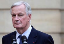 New French prime minister Michel Barnier looks on right during the handover ceremony, Thursday, Sept. 5, 2024 in Paris. President Emmanuel Macron has named EU's Brexit negotiator Michel Barnier as France's new prime minister after more than 50 days of caretaker government. (Stephane de Sakutin/Pool Photo via AP).