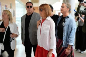 Gisele Pelicot, center, arrives in the Avignon court house, in Avignon, southern France, Thursday, Sept. 5, 2024. A woman allegedly drugged by her ex-husband so that she could be raped by other men while she laid unconscious, is expected to testify before a panel of French judges. (AP Photo/Lewis Joly).