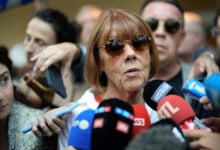 Gisele Pelicot speaks to media as she leaves the Avignon court house, southern France, Thursday, Sept. 5, 2024. A woman allegedly drugged by her ex-husband so that she could be raped by other men while she laid unconscious, is expected to testify before a panel of French judges. (AP Photo/Lewis Joly).