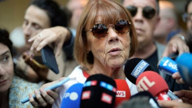 Gisele Pelicot speaks to media as she leaves the Avignon court house, southern France, Thursday, Sept. 5, 2024. A woman allegedly drugged by her ex-husband so that she could be raped by other men while she laid unconscious, is expected to testify before a panel of French judges. (AP Photo/Lewis Joly).