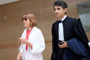 Gisele Pelicot, left, arrives in the Avignon court house, in Avignon, southern France, Thursday, Sept. 5, 2024. (AP Photo/Lewis Joly, File).