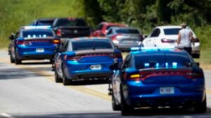 Georgia State patrol vehicles move toward Apalachee High School after a shooting at the school, Wednesday, Sept. 4, 2024, in Winder, Ga.  (AP Photo/Mike Stewart).