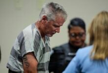 Colin Gray, 54, the father of Apalachee High School shooter Colt Gray, 14, enters the Barrow County courthouse for his first appearance, on Friday, Sept. 6, 2024, in Winder, Ga. (AP Photo/Brynn Anderson, Pool).