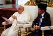 Pope Francis, left, delivers his address as Indonesian President Joko Widodo looks on during a meeting with Indonesian authorities, civil society and the diplomatic corps, during his apostolic visit to Asia, at the Presidential Palace in Jakarta Wednesday, Sept. 4, 2024. (Willy Kurniawan/Pool Photo via AP).