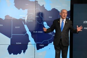 Israeli Prime Minister Benjamin Netanyahu stands before a map during a press conference at the Government Press office in Jerusalem, Wednesday, Sept. 4, 2024. (Abir Sultan/Pool via AP).