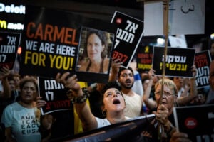 People protest against Prime Minister Benjamin Netanyahu's government and call for the release of hostages held in the Gaza Strip by the Hamas militant group, in Tel Aviv, Israel, Saturday, Sept. 7, 2024. (AP Photo/Leo Correa).