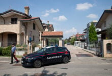 Italian Carabinieri patrol outside the house where a 17-year-old boy killed his brother and parents in Paderno Dugnano near Milan, northern Italy, Sunday, Sept. 1, 2024. Italian prosecutors on Monday said a 17-year-old high school student who confessed to stabbing to death his 12-year-old brother and parents had been suffering a general sense of “malaise,” but has been unable to provide a motive for a triple homicide that has shocked Italians. (Marco Ottico/Lapresse via AP).