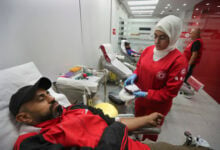 People donate blood for those who were injured by their exploded handheld pagers, at a Red Cross center, in the southern port city of Sidon, Lebanon, Tuesday, Sept. 17, 2024. (AP Photo/Mohammed Zaatari).