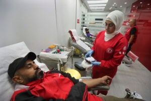 People donate blood for those who were injured by their exploded handheld pagers, at a Red Cross center, in the southern port city of Sidon, Lebanon, Tuesday, Sept. 17, 2024. (AP Photo/Mohammed Zaatari).