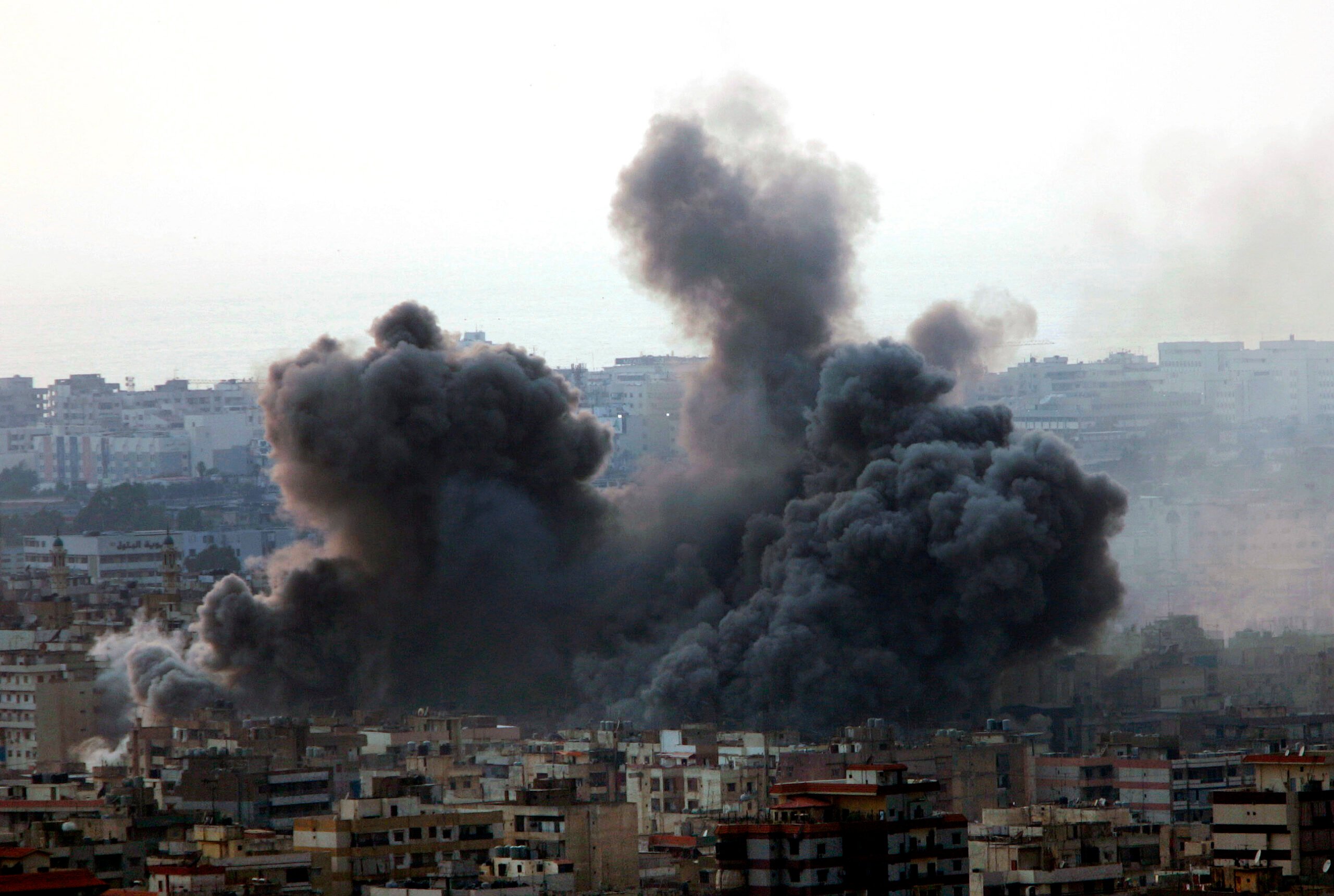 An Israeli air strike hits a residential area that is a Hezbollah stronghold, in the southern suburbs of Beirut, Lebanon, on July 15, 2006. (AP Photo/Hussein Malla, File).