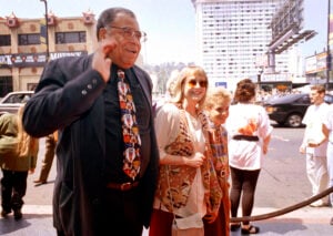 James Earl Jones, left, greets the press along with his wife Cecilia, center, and son Flynn, right, at the premiere of "The Lion King" in Los Angeles, June 12, 1994. Jones, who overcame racial prejudice and a severe stutter to become a celebrated icon of stage and screen has died at age 93, Monday, Sept. 9, 2024. (AP Photo/Tara Farrell, File).