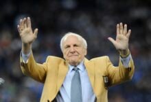 Detroit Lions head coach Joe Schmidt acknowledges the crowd after receiving a Pro Football Hall of Fame ring during a ceremony at halftime of an NFL football game between the Detroit Lions and the Chicago Bears, Oct. 18, 2015, in Detroit. (AP Photo/Jose Juarez, File).