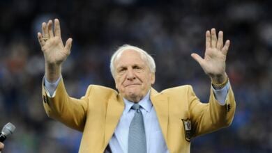 Detroit Lions head coach Joe Schmidt acknowledges the crowd after receiving a Pro Football Hall of Fame ring during a ceremony at halftime of an NFL football game between the Detroit Lions and the Chicago Bears, Oct. 18, 2015, in Detroit. (AP Photo/Jose Juarez, File).